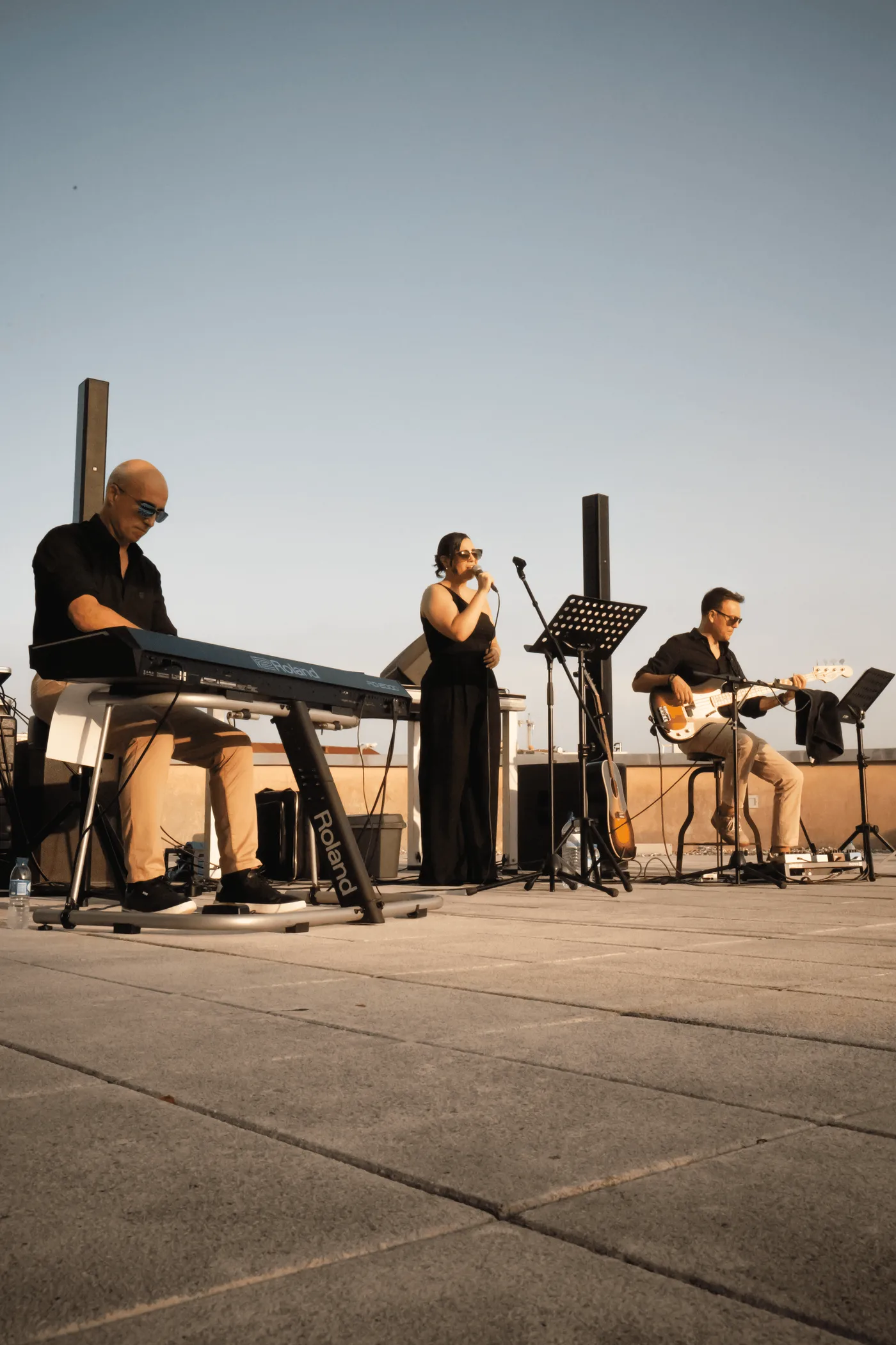 Smooth Bit playing on a rooftop: keys, vocals and guitar.