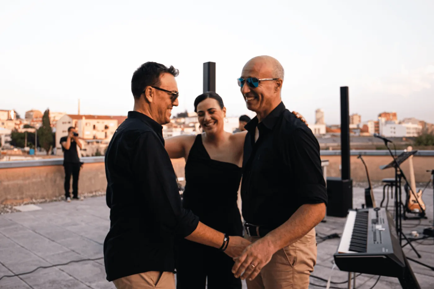 The three laughing and hugging at the end of the session.